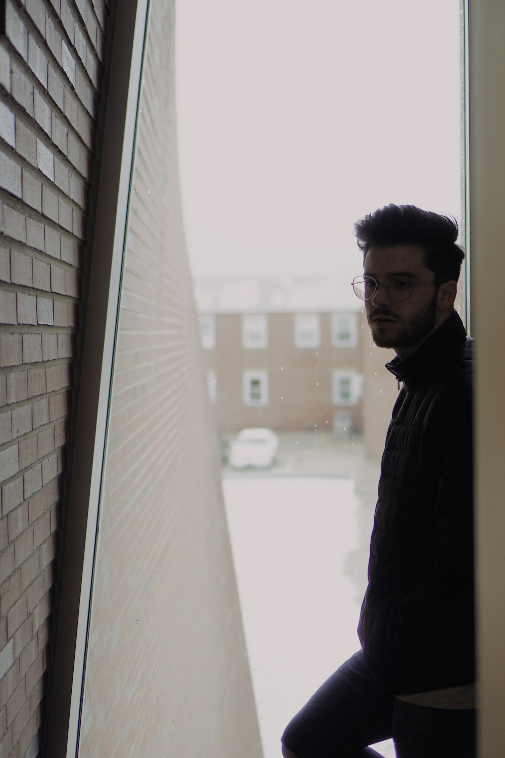 man standing between wall