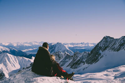 A couple enjoying a serene mountain view during a private tour in northern Pakistan.