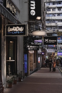 A bustling commercial street lined with shops and offices, capturing the energy of business spaces.