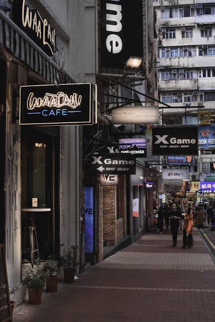 A bustling commercial street lined with shops and offices, capturing the energy of business spaces.