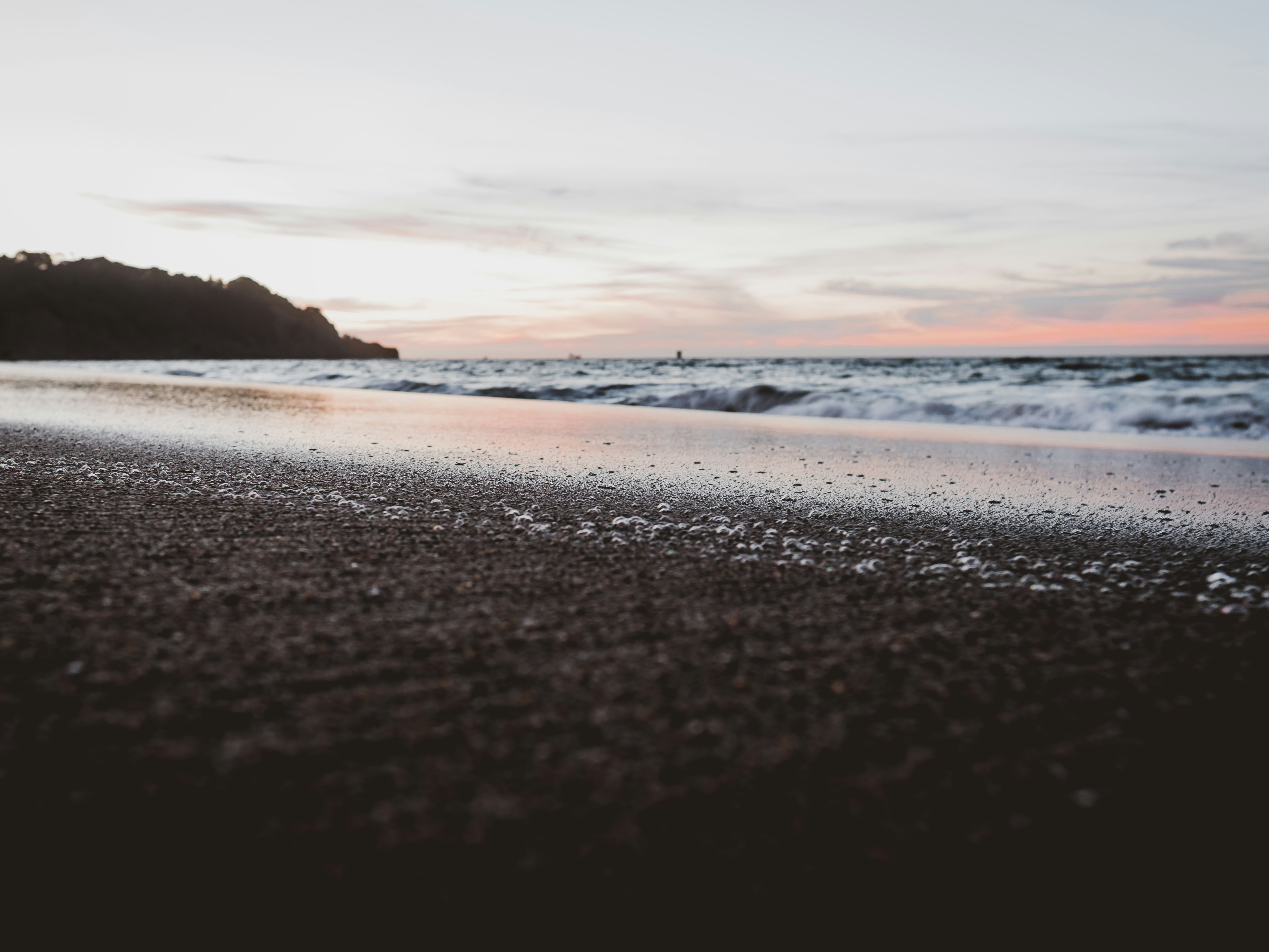 low angle photo of sea shore