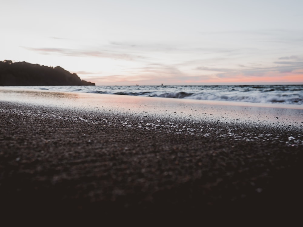 low angle photo of sea shore