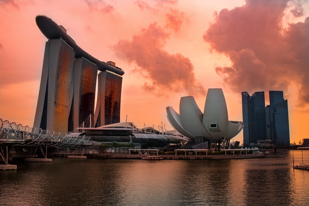 high-rise building beside body of water