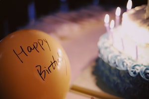 yellow balloon near cake