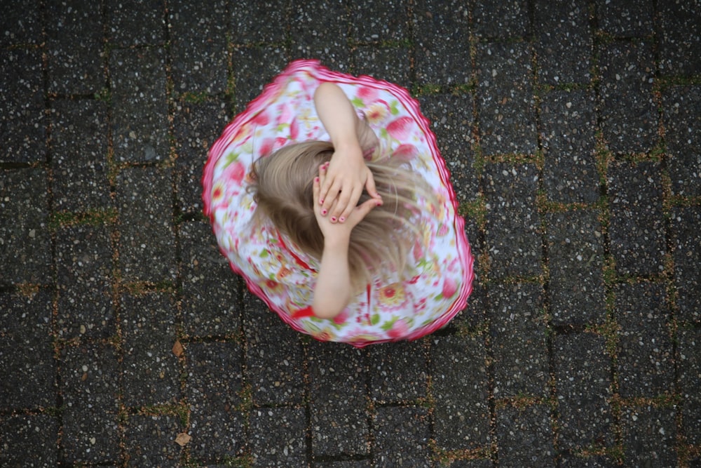 girl sitting on ground