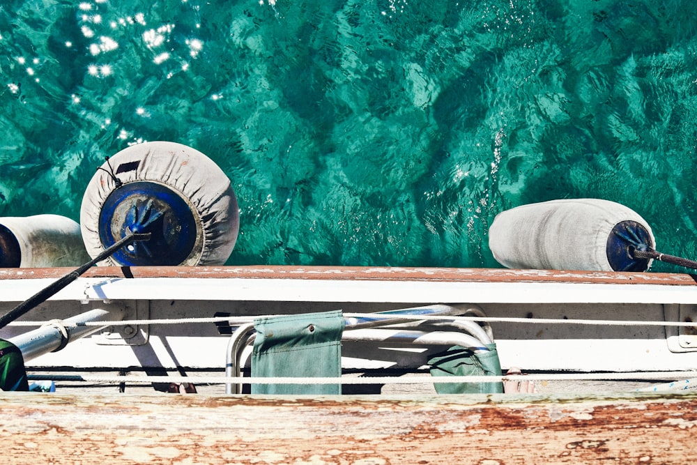 white buoy hanging on boat