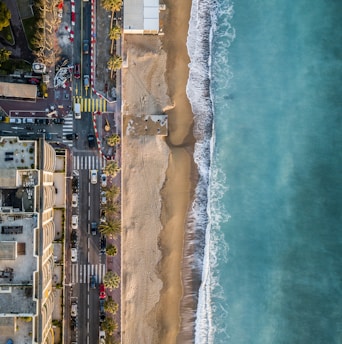 aerial photography of seashore near city at daytime