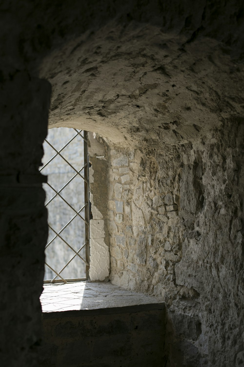 photo of rock house near window