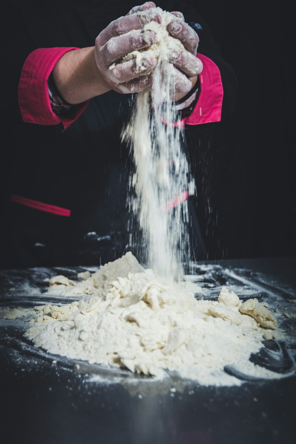 person mixing dough