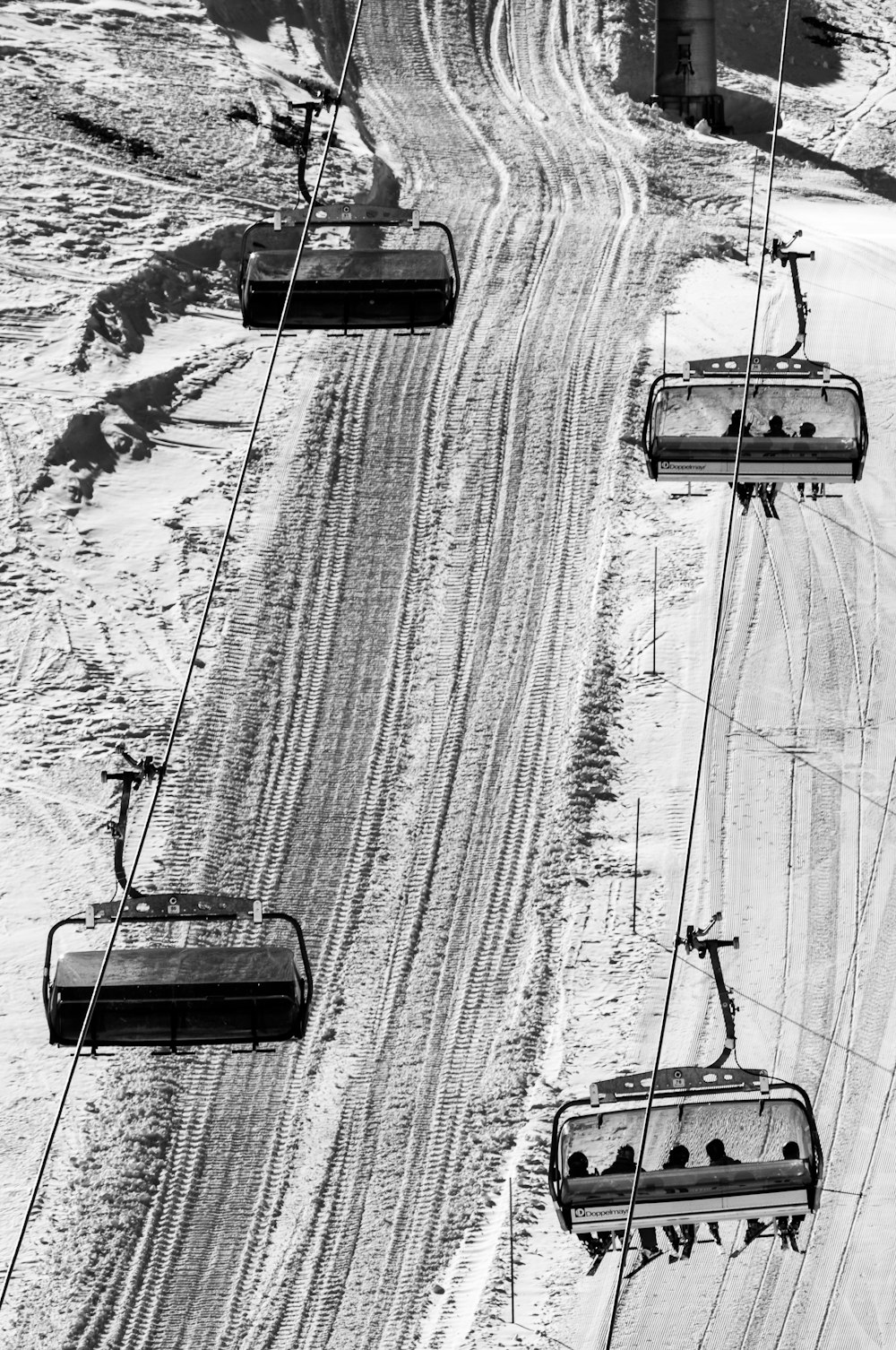 grayscale photo of bird's eye view of cable trains