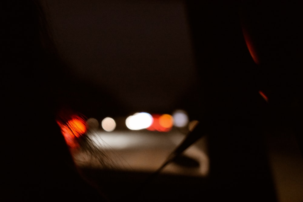 a blurry photo of a street at night