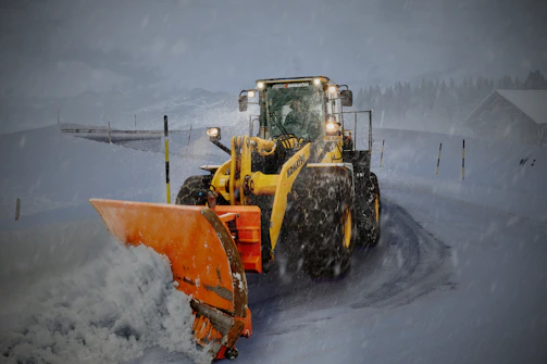 Snow being efficiently cleared from a driveway in Vail by a professional plow.