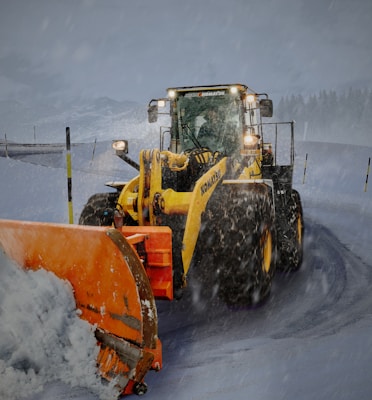 yellow and orange snow plouh