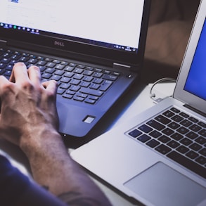 person using black laptop computer