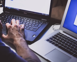 person using black laptop computer