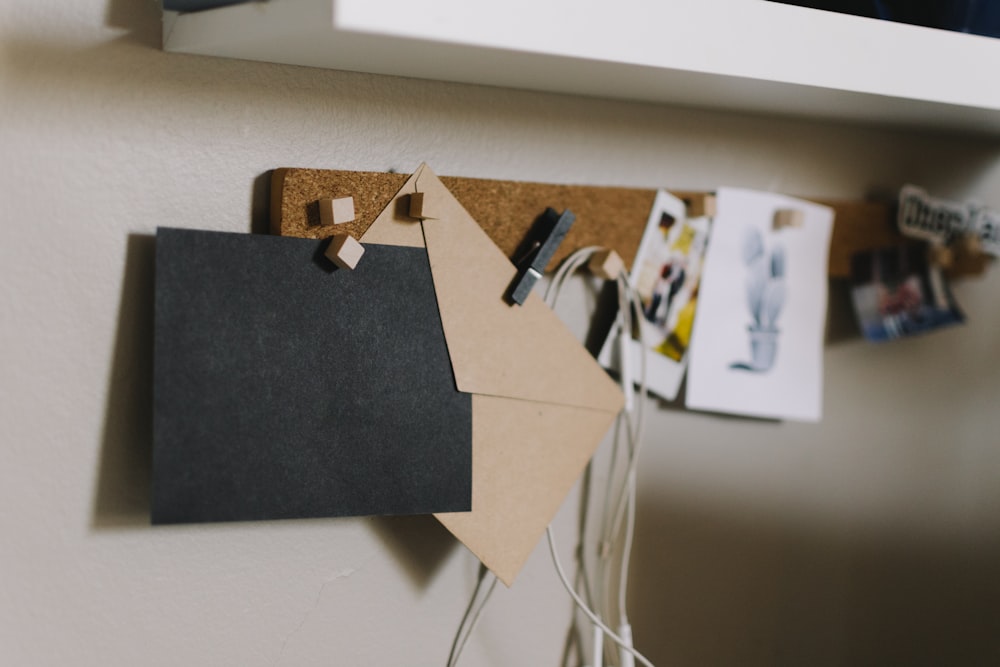 brown cork board with papers