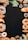 An assortment of baked goods, including bread, croissants, donuts, and pretzels, is arranged around the borders of a dark background. There are decorative elements such as green leaves and a small cup of coffee beans. The breads have different shapes, textures, and some are topped with seeds.