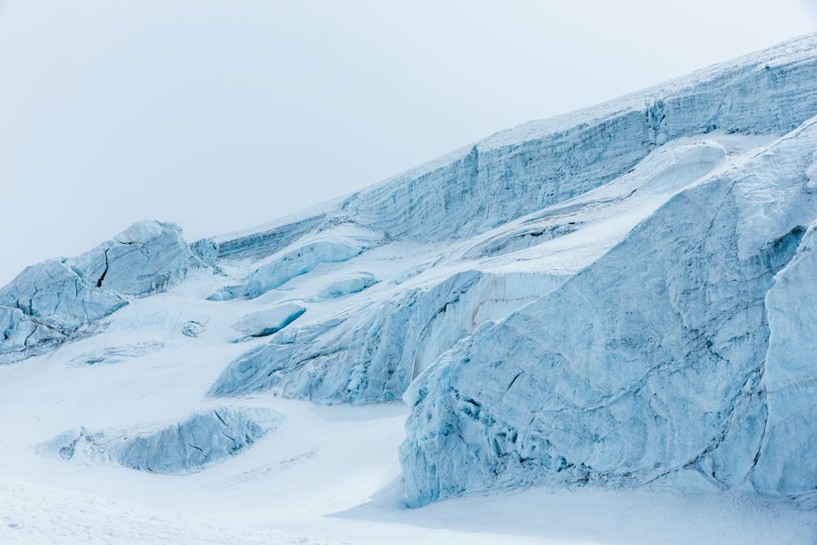 Frozen glacial landscape under pale light