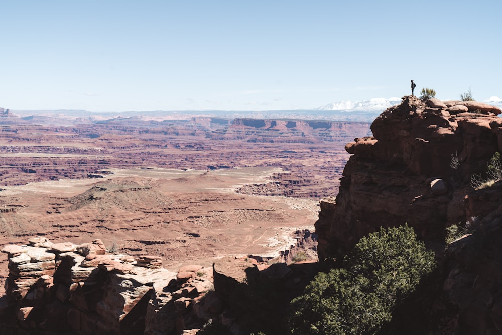 man standing on cliff