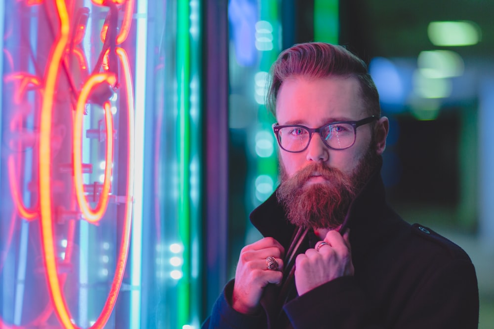 man holding black coat