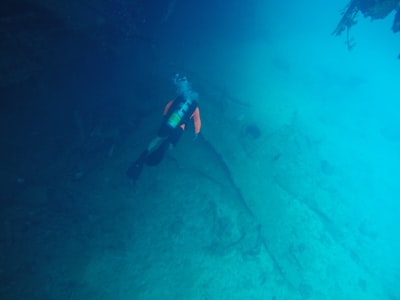 man diving in water marshall islands teams background