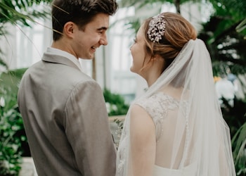 bride and groom surrounded by plants