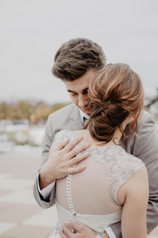 couple hugging under gray sky
