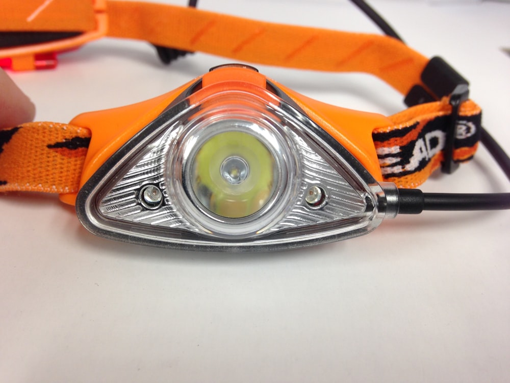 silver and orange head lamp