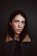 portrait photograph of woman in gray and brown coat