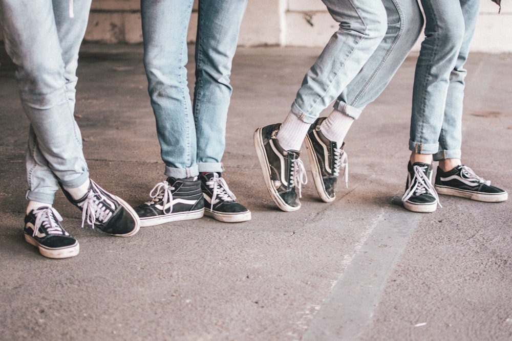 grayscale photo of person wearing Vans low-top sneakers photo – Free Image  on Unsplash