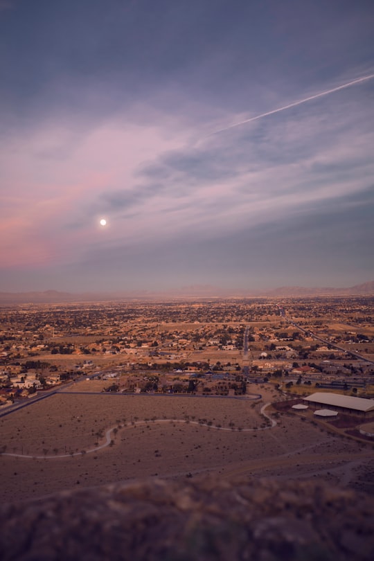 aerial photography of brown fields with houses under sun during daytime in Lone Mountain United States