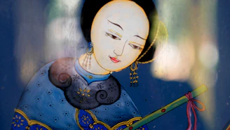 A stylized portrait of a person with delicate features, adorned in a traditional outfit with intricate patterns. The figure appears to be holding a green and red object, possibly a musical instrument, against a blurred, colorful background.