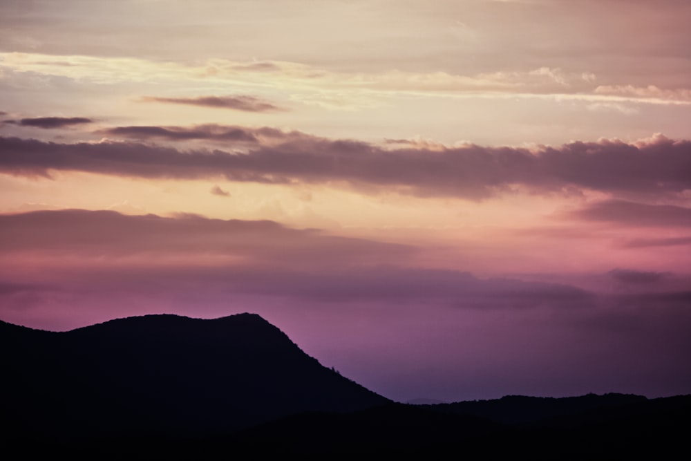 silhouette of mountain during dawn