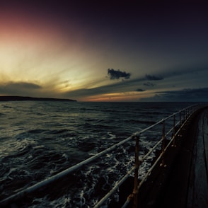 body of water during sunset