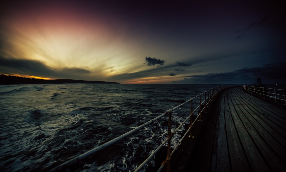 body of water during sunset