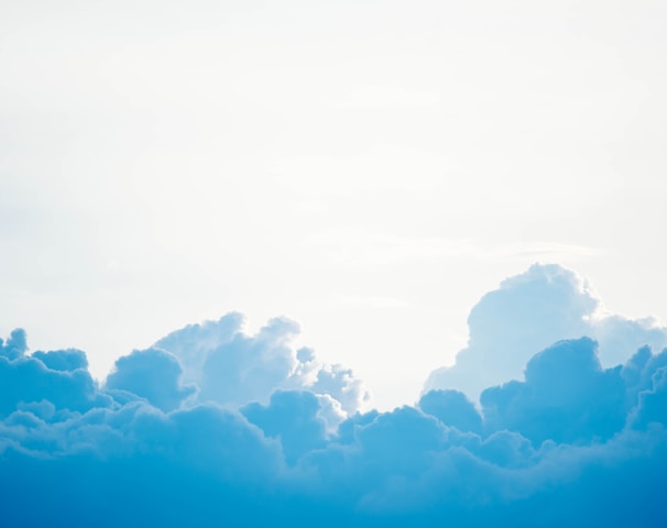 blue clouds under white sky