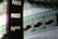 A close-up of a filmstrip with several frames, partially featuring the word 'PAUZE' vertically against a dark background. The image also shows segments of the film containing images, possibly of a boat or similar object, with the filmstrip showing shades of blue, black, and transparent sections.