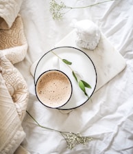 white teacup filled with coffee