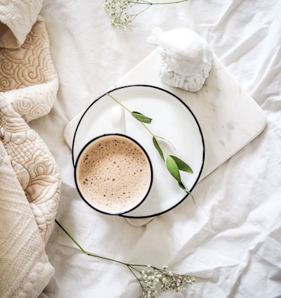 white teacup filled with coffee