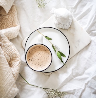 white teacup filled with coffee