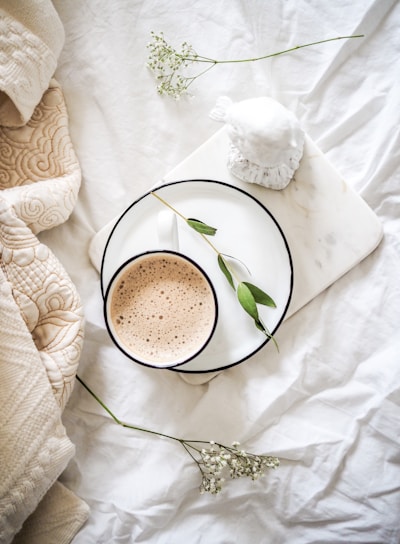 white teacup filled with coffee