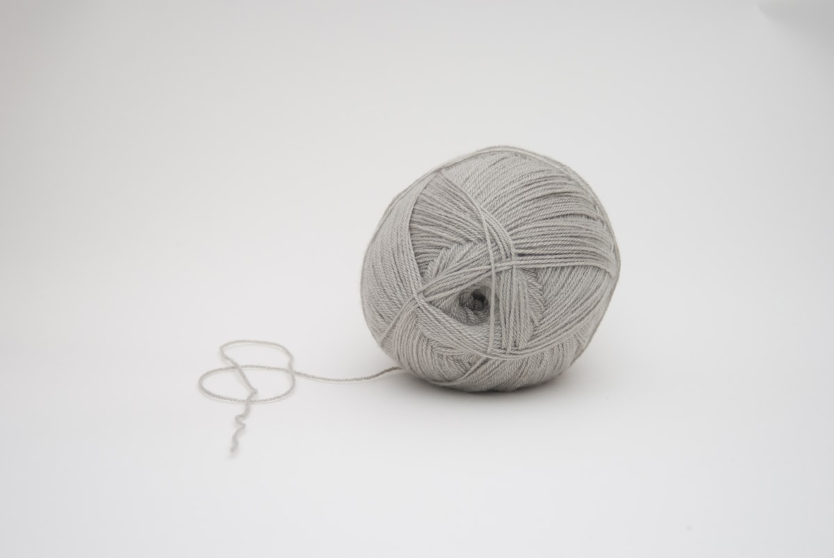 A soft ball of yarn resting on a table, ready for a relaxed crochet session