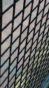 Various types of wire mesh and fencing materials displayed outdoors.