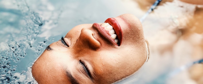 floating woman on body of water