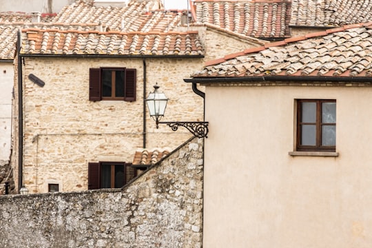 photo of beige concrete houses in Volterra Italy