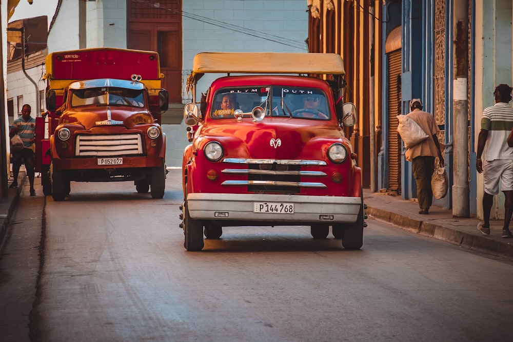 red Dodge car on asphalt road during daytime