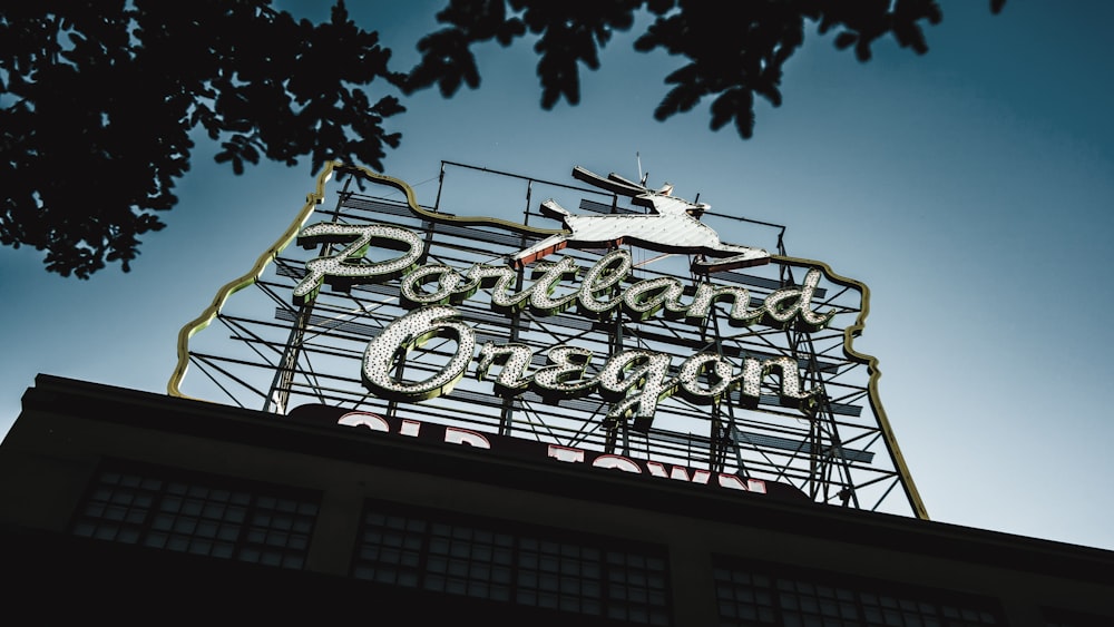 Portland Oregon neon signage near green tree