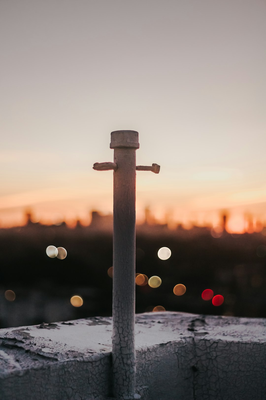 bokeh photograph of metal pole