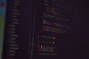 Futuristic code snippets overlayed on a dark matrix-inspired digital interface.