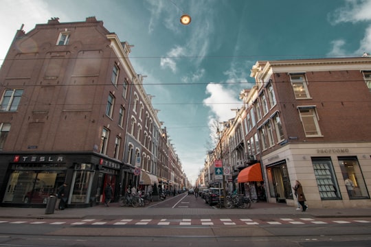 empty road in between buildings in Rijksmuseum Netherlands